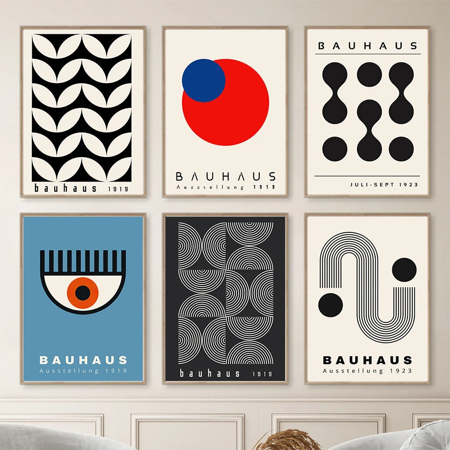 Collection of Bauhaus style posters on a wall.
