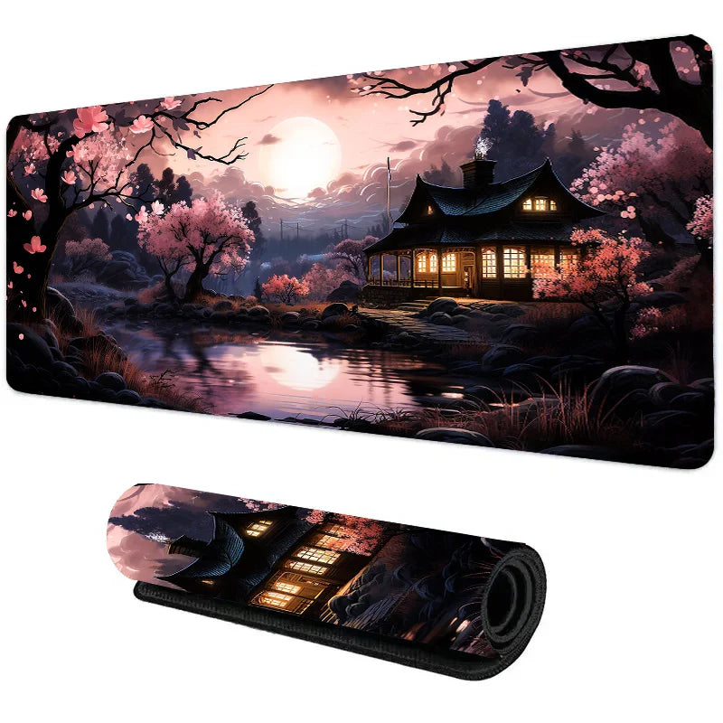 Wide desk mat with dark cherry blossom night scene, glowing Japanese house reflected in a moonlit river