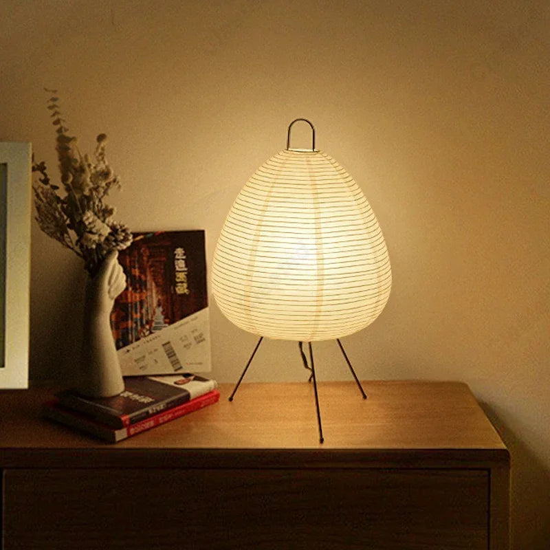 Japanese style table lamp on a wooden surface with a warm glow