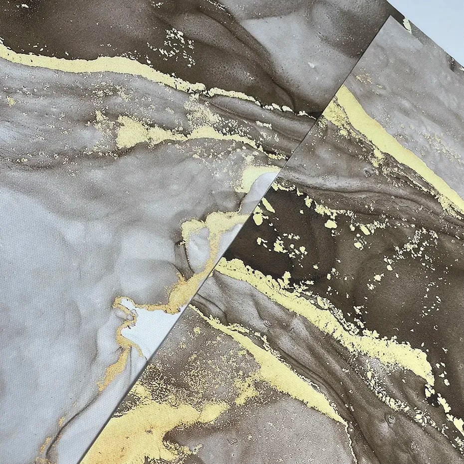 Marble-like pattern with gold accents on a textured surface