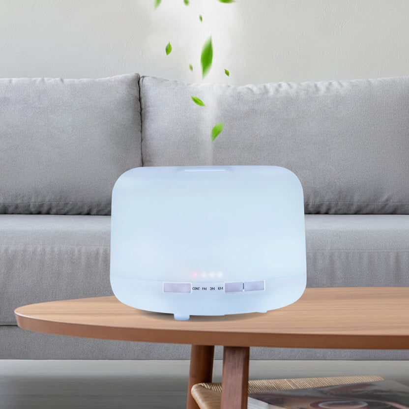 Aromatherapy diffuser on a wooden table with a gray sofa in the background.