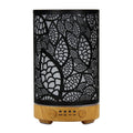 100ml black leaf pattern diffuser with light wood grain base on a white background.