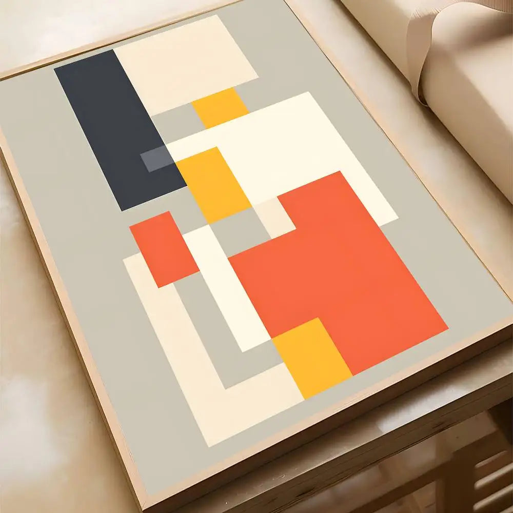 Abstract geometric canvas print with interlocking navy, orange, yellow, and cream rectangles on a light grey background, in a wood frame.