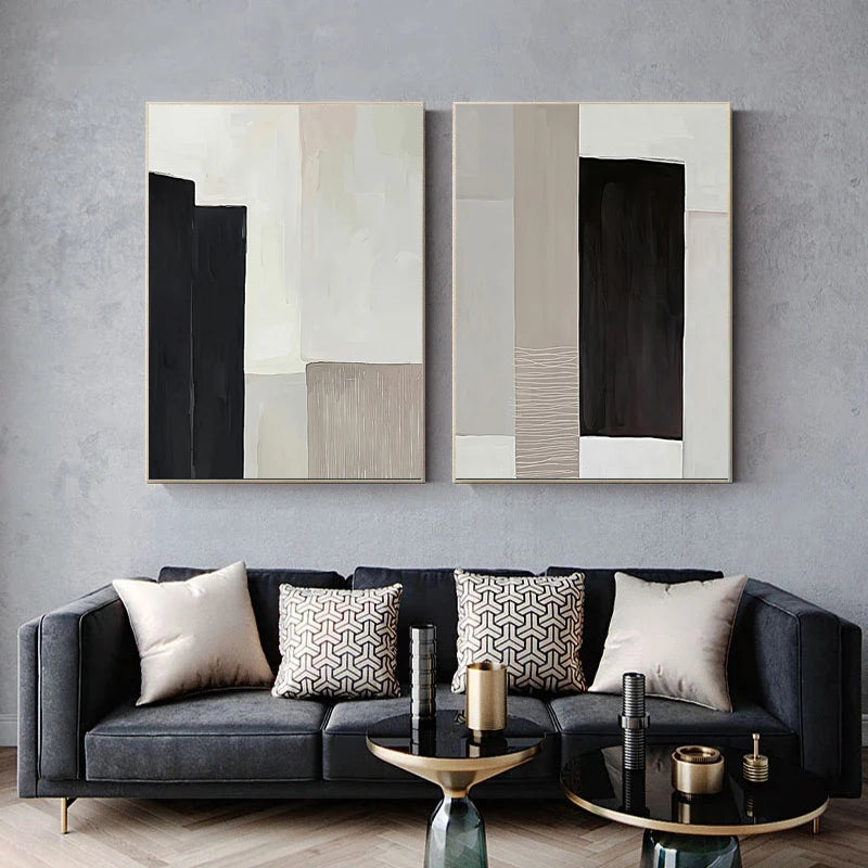Modern living room with a gray sofa, abstract wall art, and decorative items.