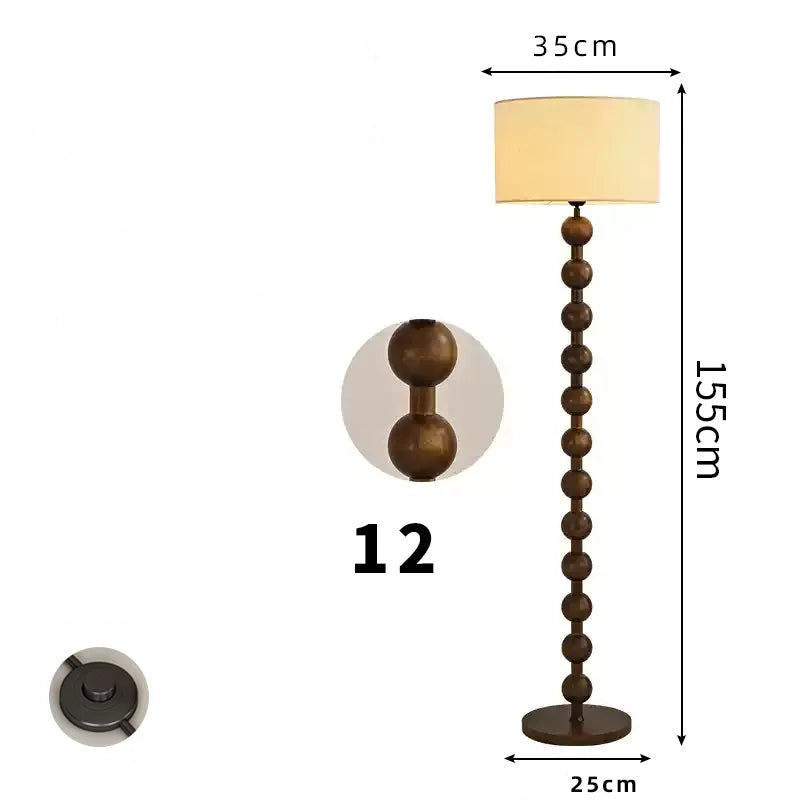 Retro floor lamp featuring 12 stacked natural wood spheres, a cream fabric shade, and a 155cm height profile.