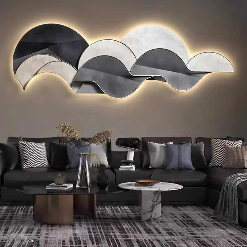 Abstract layered plexiglass wall light in neutral tones styled above a modern grey sofa