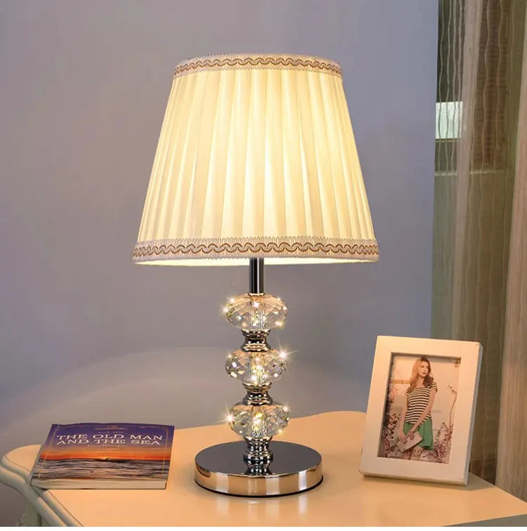 table lamp with a timeless cream-colored pleated fabric shade.