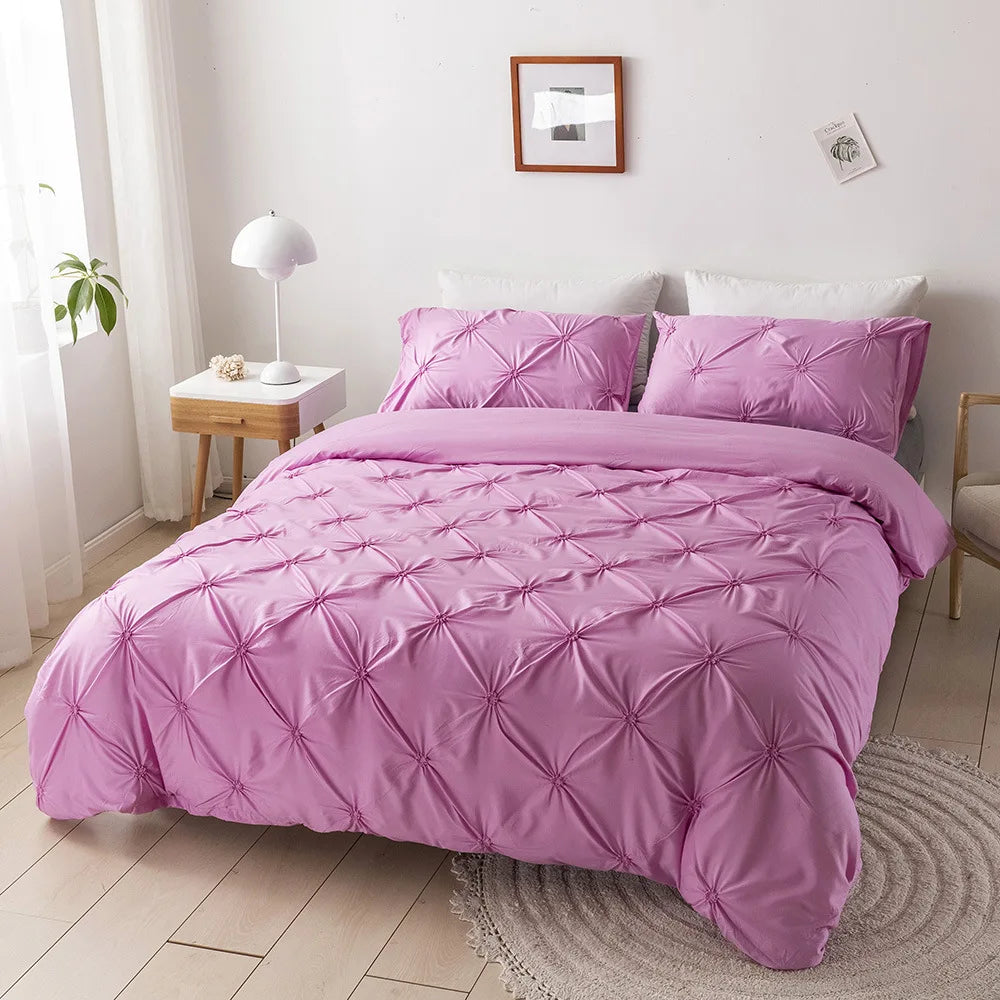Pink 3D pinch pleated duvet cover set in a bright bedroom with matching pillowcases.