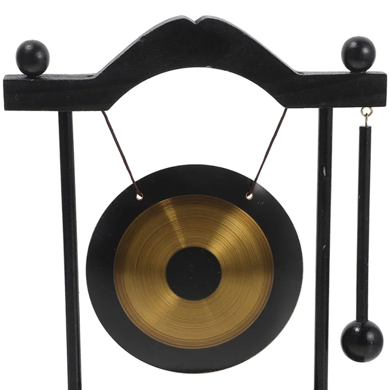 Decorative gong with black stand on a white background