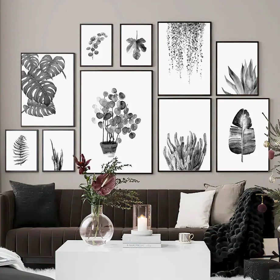Living room with a wall of framed botanical prints and a sofa.