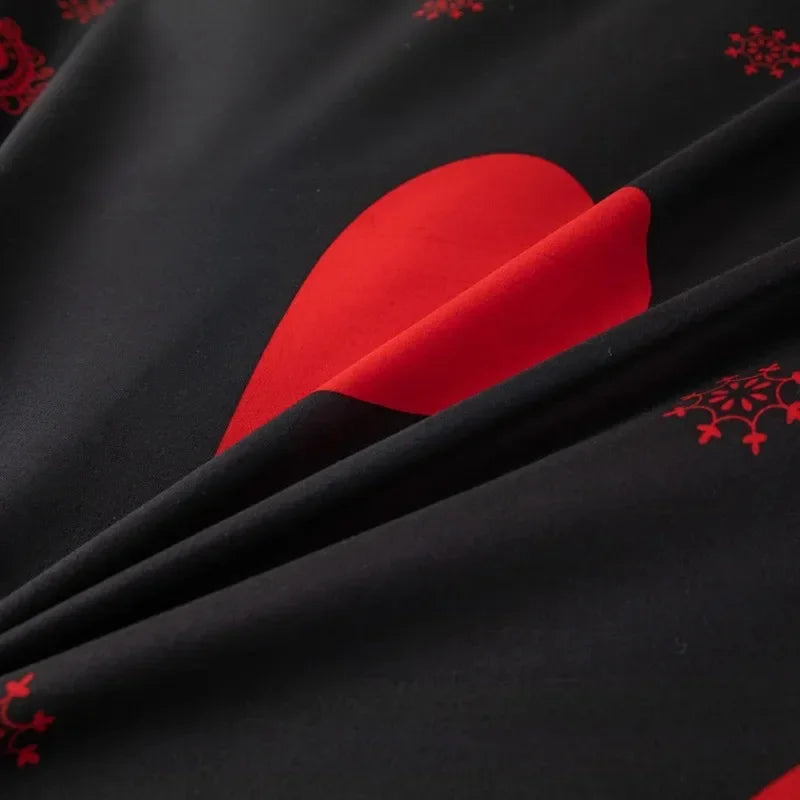 Black bedding set with red heart print and matching pillowcases