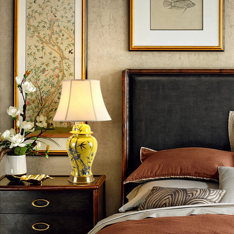 Tall yellow ceramic floral table lamp with a white fabric shade and a height of 68 cm