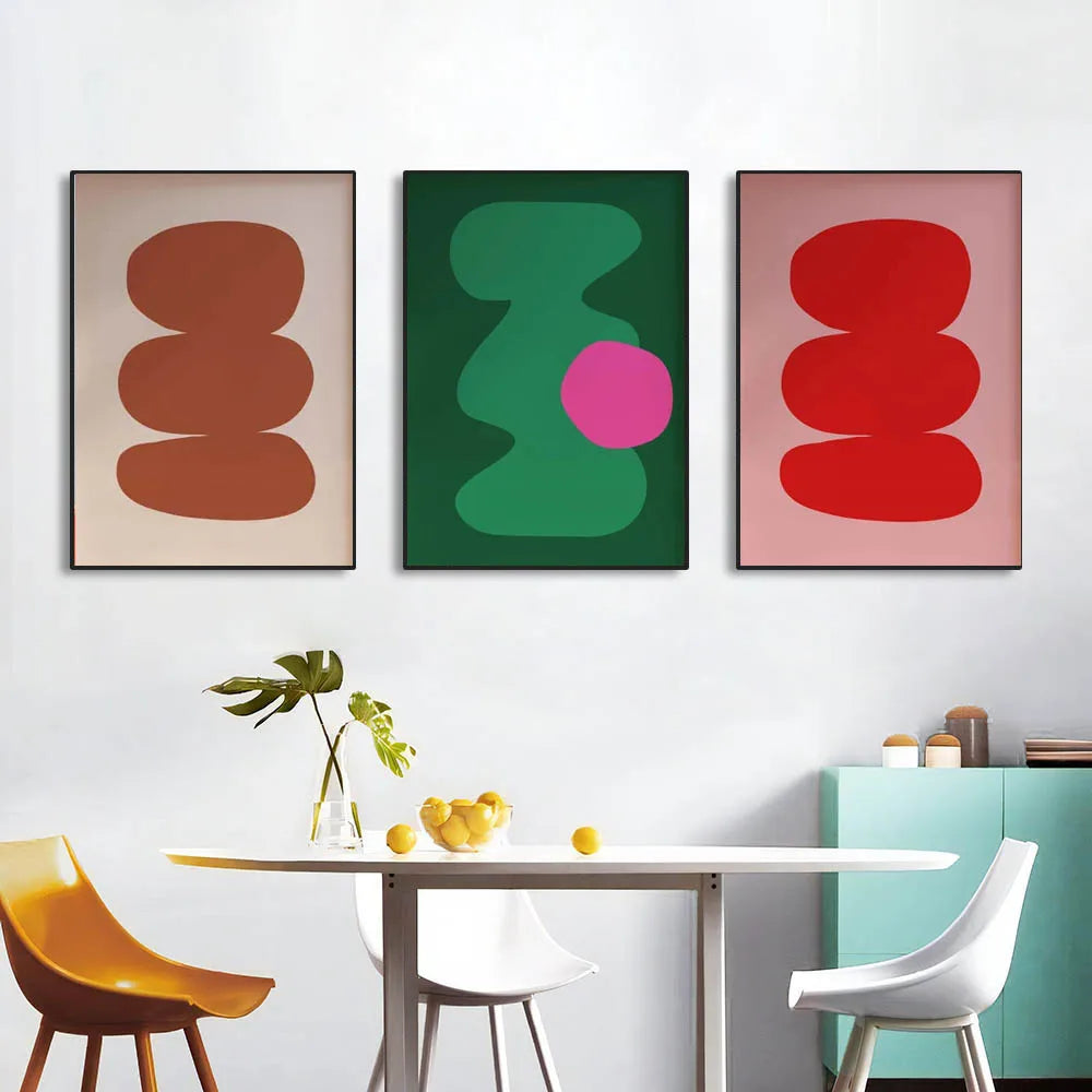 Three geometric canvas art prints in frames on a white background