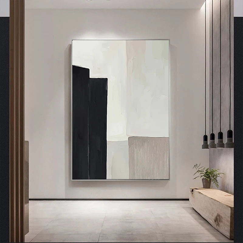 Minimalist abstract canvas print with bold black shape, soft cream tones, and a textured beige panel.