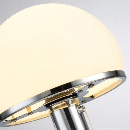 Close-up of frosted dome shade with polished chrome trim
