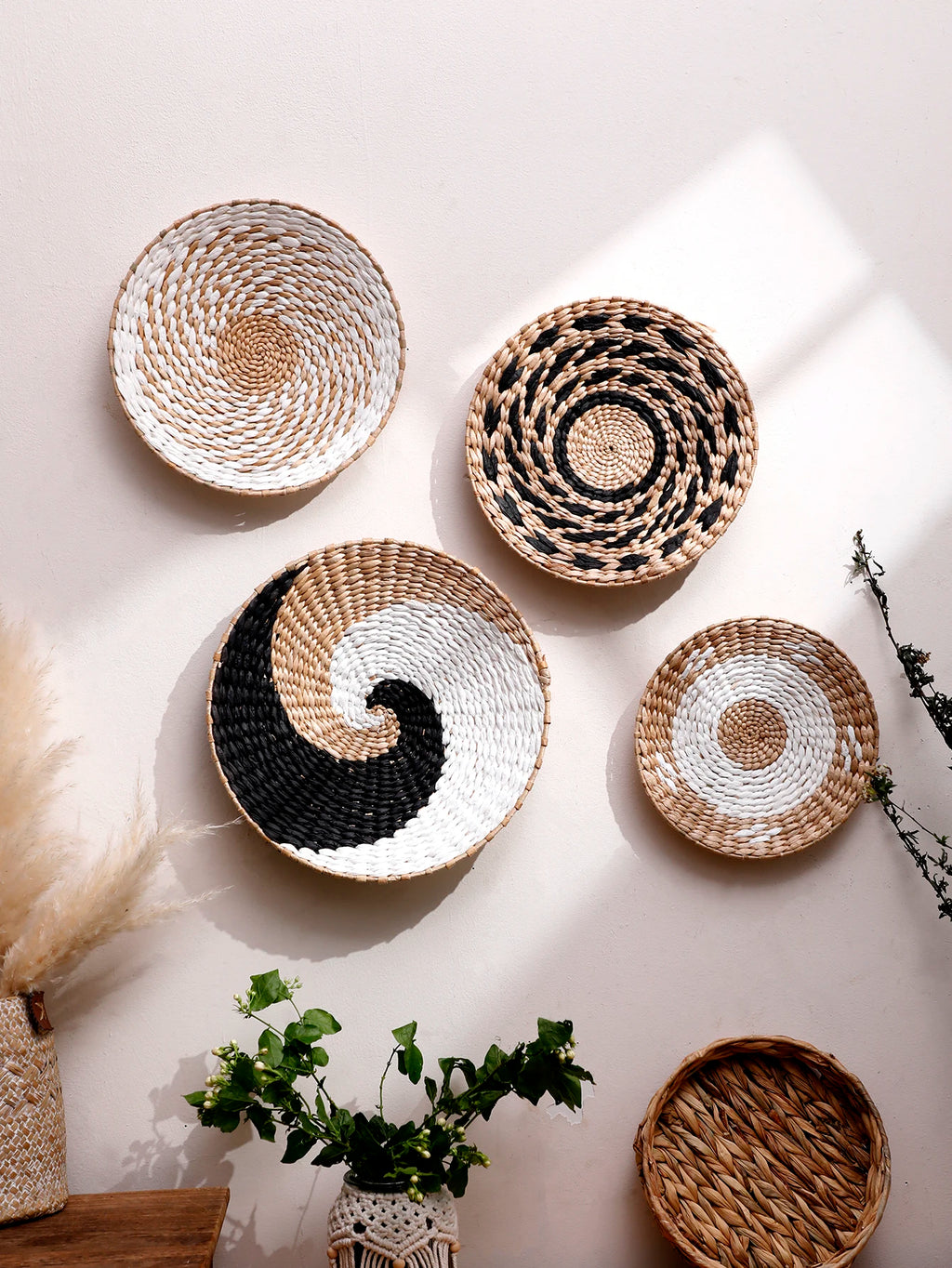 Woven baskets of various sizes and designs on a light background