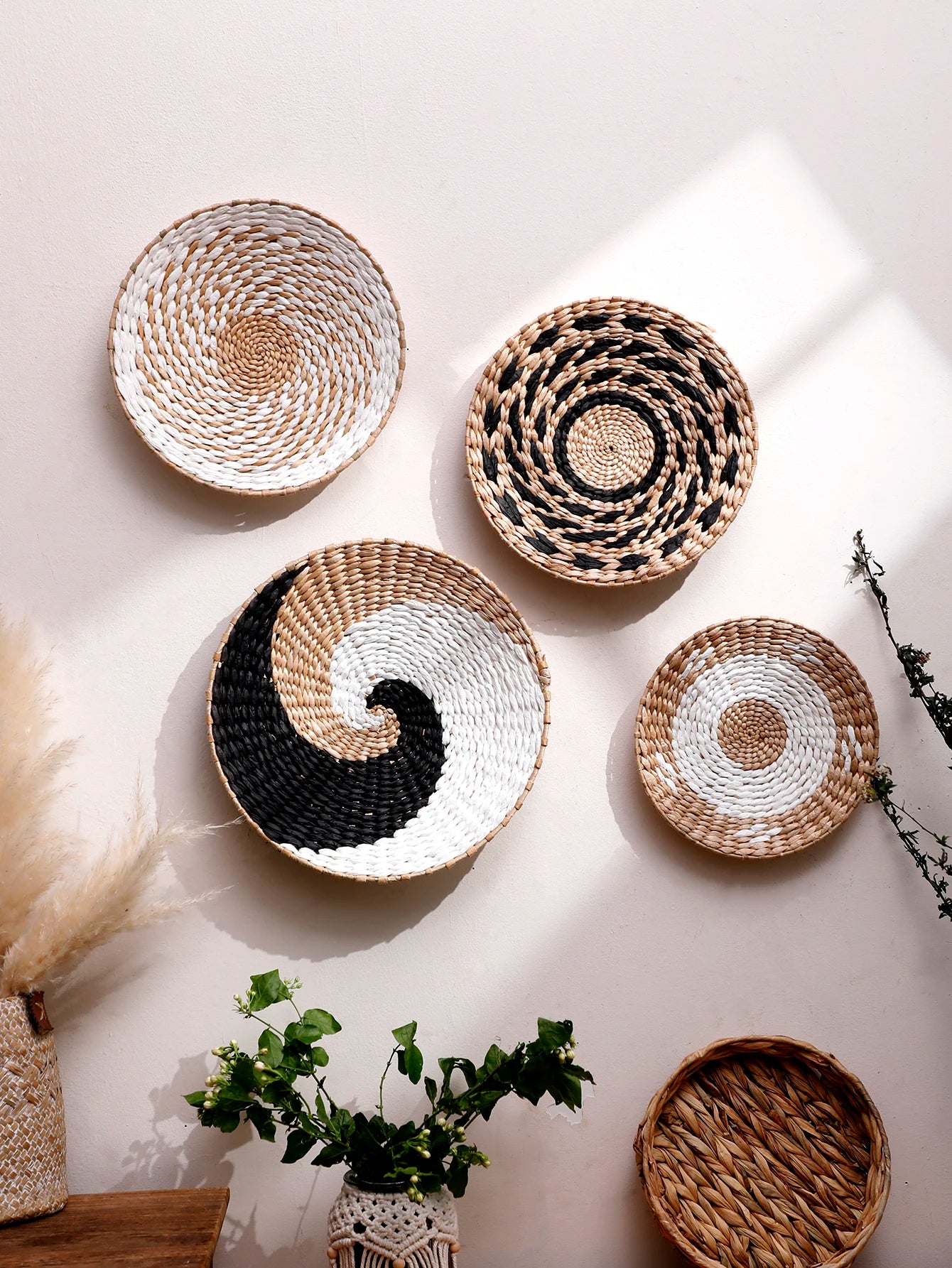 Woven baskets of various sizes and designs on a light background