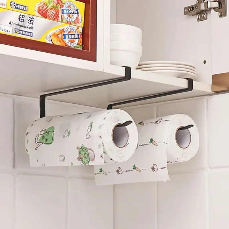 Under-shelf paper towel holder with two rolls of paper towels in a kitchen setting.