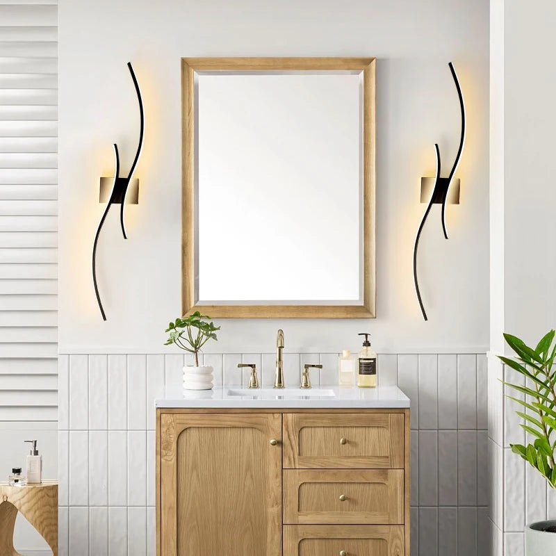 Modern black wall sconce in a dining room setting with chairs and a window.
