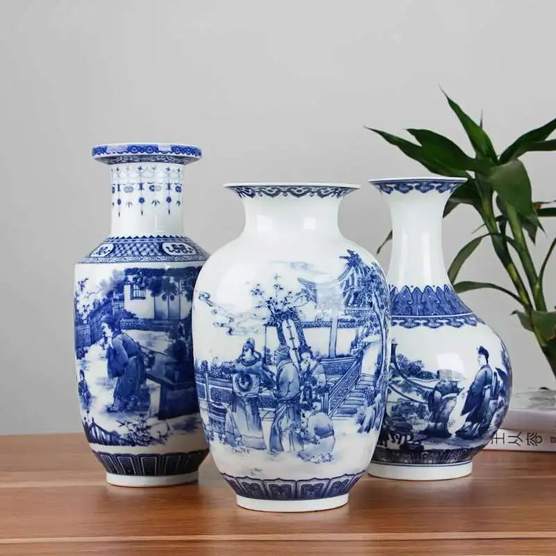 Three blue and white ceramic vases with intricate designs on a wooden surface.