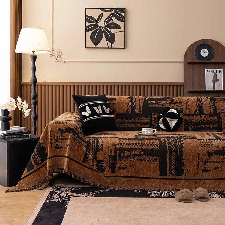 Brown chenille sofa cover with tribal block pattern styled on a sofa with decorative cushions
