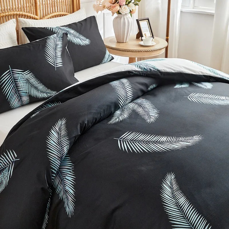 Black duvet cover set with white tropical palm leaf print and matching pillowcases