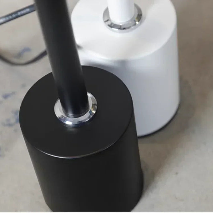 Weighted cylindrical wedge base in black and white