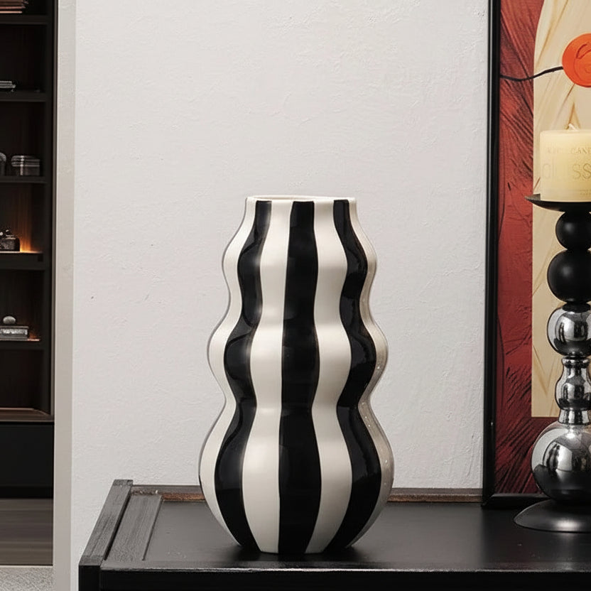 Black and white striped vase on a table with dimensions displayed
