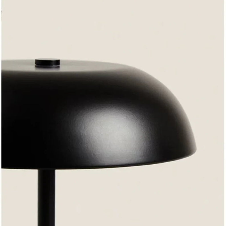 Close-up of a black lampshade on a beige background