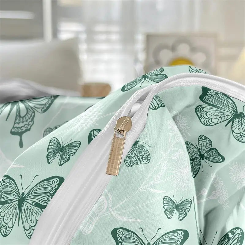 Close-up of zipper closure and sage butterfly-print fabric on a duvet cover set.