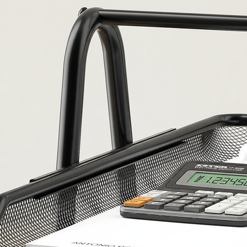 Close-up of black metal mesh document tray with curved frame