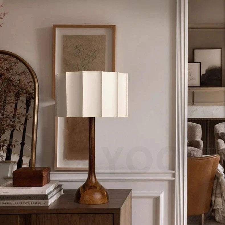 Minimalist wooden desk lamp with linen shade on sideboard