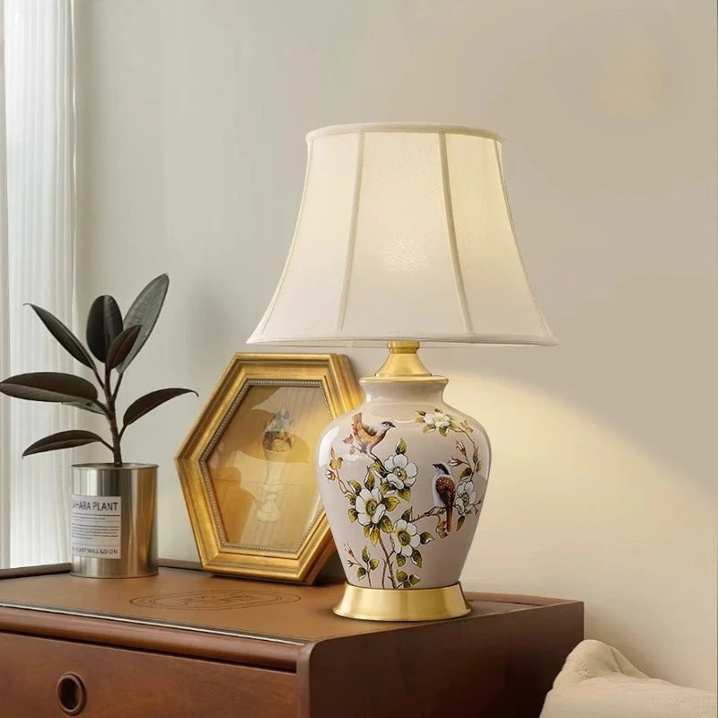 Decorative table lamp with floral design on a wooden surface