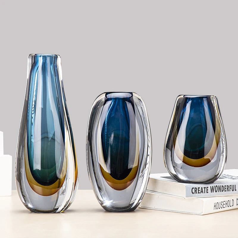 Three blue gradient glass vases displayed together as a set
