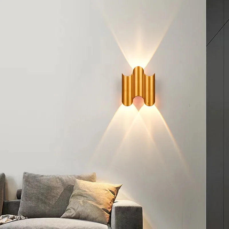 Gold 2-wave wall light with compact ripple profile and elegant up-and-down lighting pattern