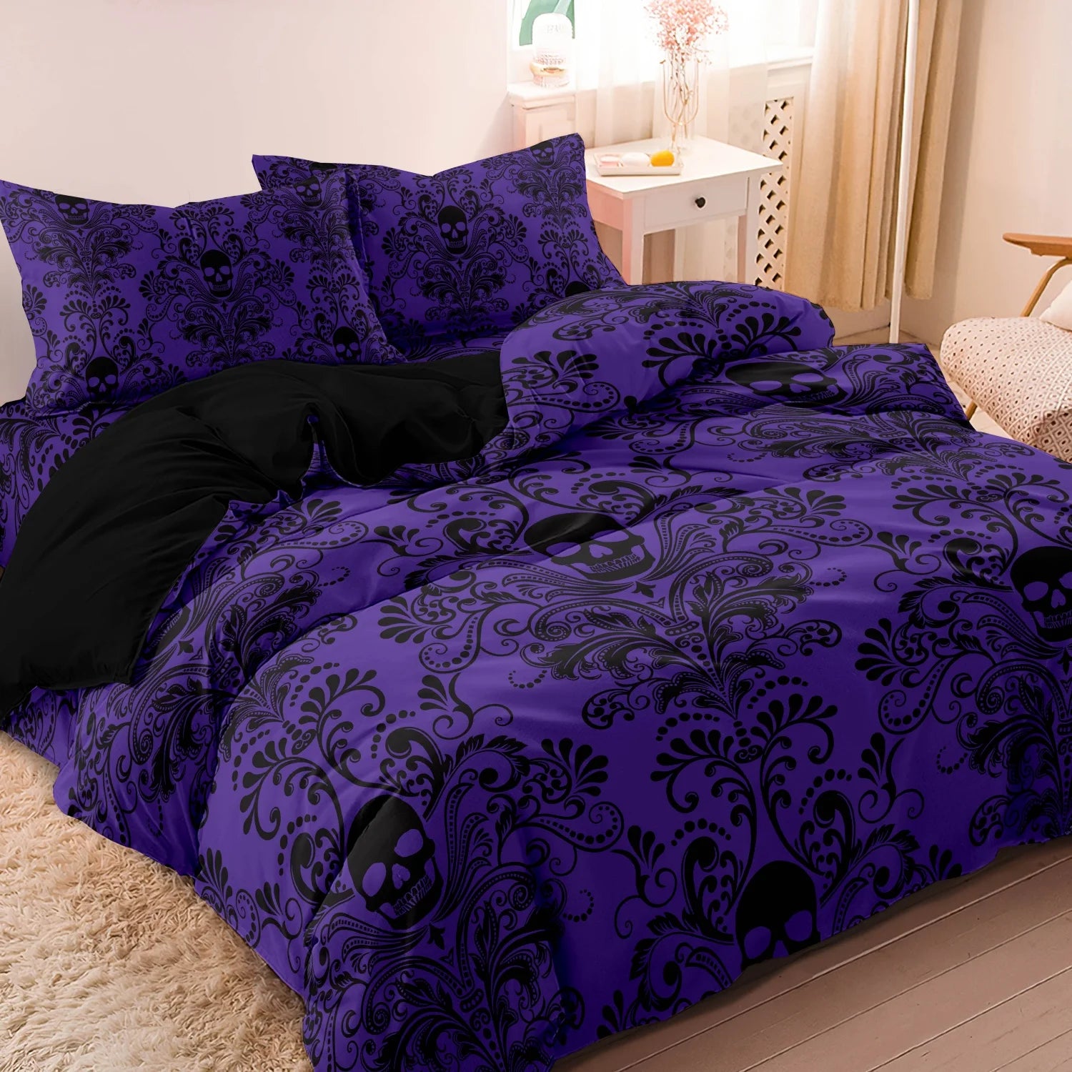 Violet purple skull print duvet cover set styled on a bed with matching pillowcases