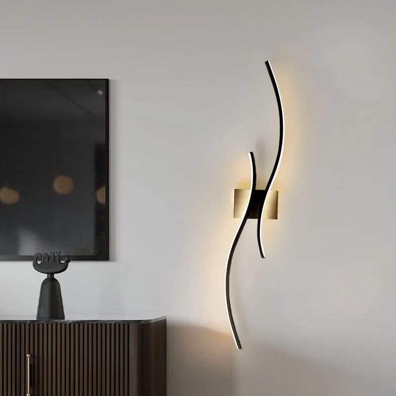 Modern black wall sconce in a dining room setting with chairs and a window.