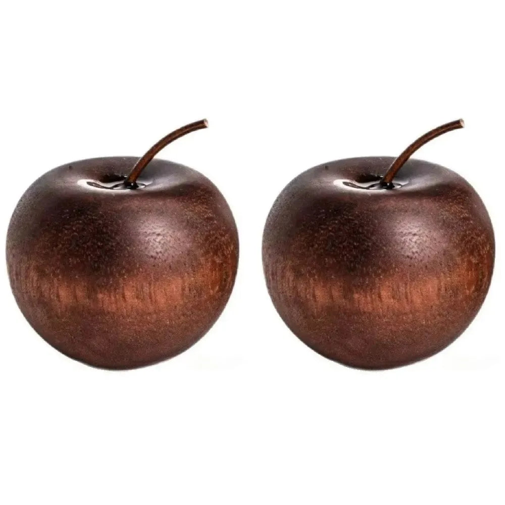 Two apple shaped oil diffusers on a white background