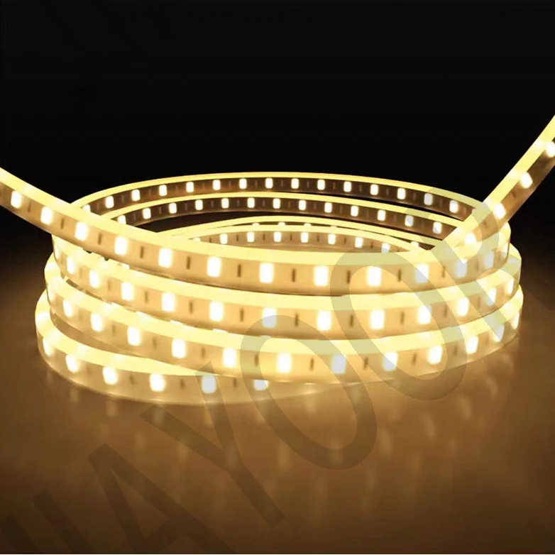 A coiled warm white LED light strip with multiple bright illuminated bulbs.