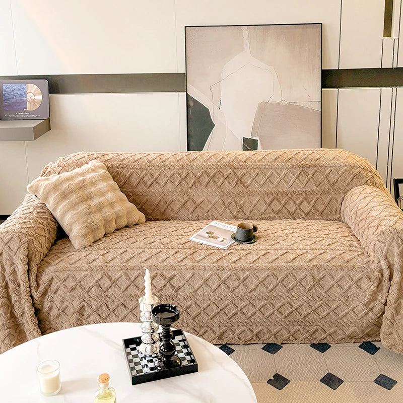 Beige sofa with a textured cover in a living room setting.
