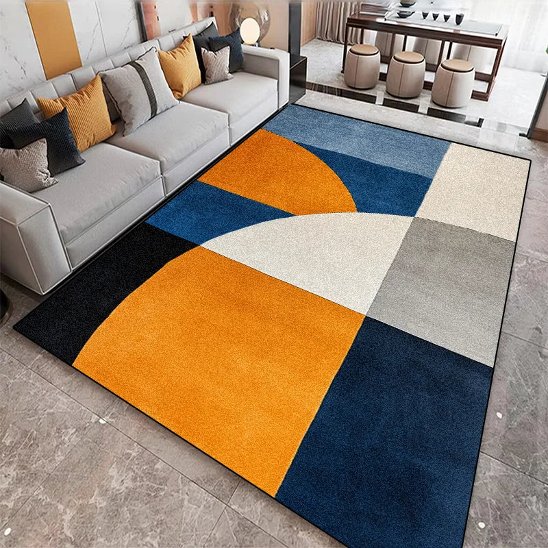 Modern area rug with bold blue, orange, and cream colour-block geometric pattern styled in a contemporary living room