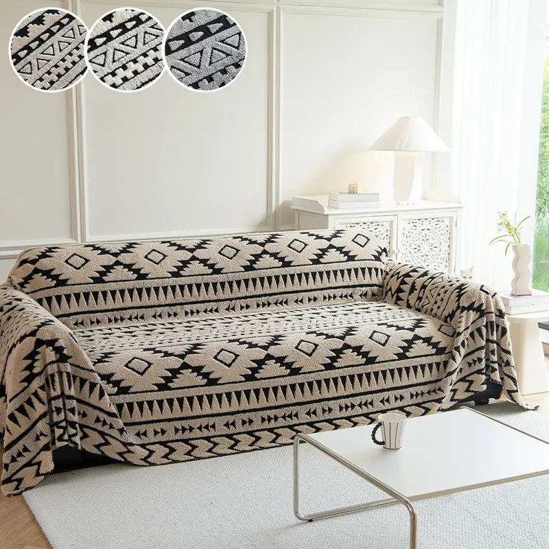 Sofa with a warm beige patterned throw blanket in a living room setting