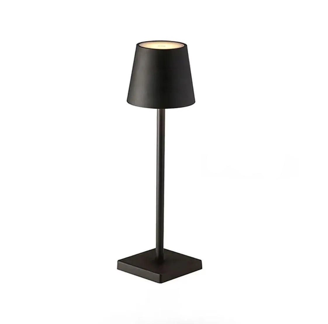 A black table lamp with a square base on a white background