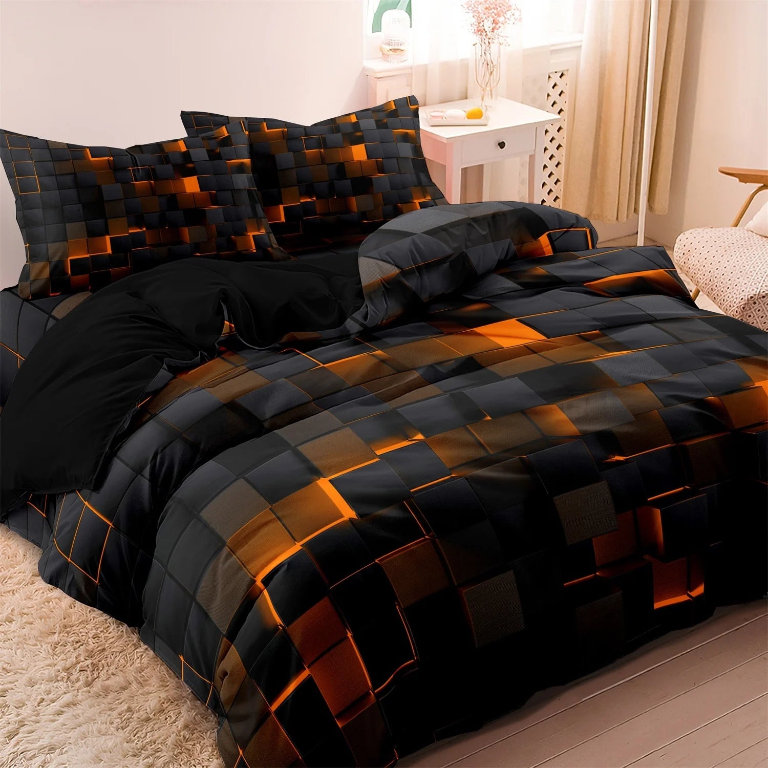 Black bedding set with orange geometric block 3D print and matching pillowcases
