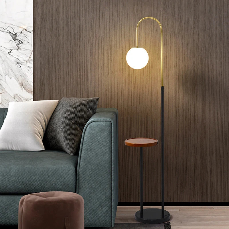 Black-and-gold Nordic floor lamp with brown tray, globe shade, round base,