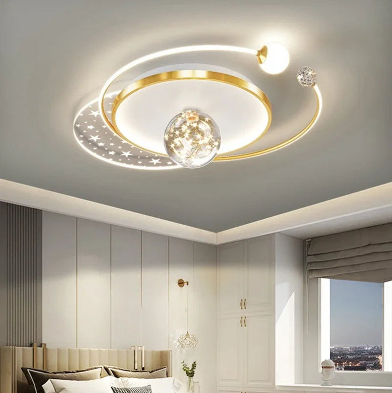 Gold circular orbital LED ceiling light with star panel and crystal ball detail, 52×40cm