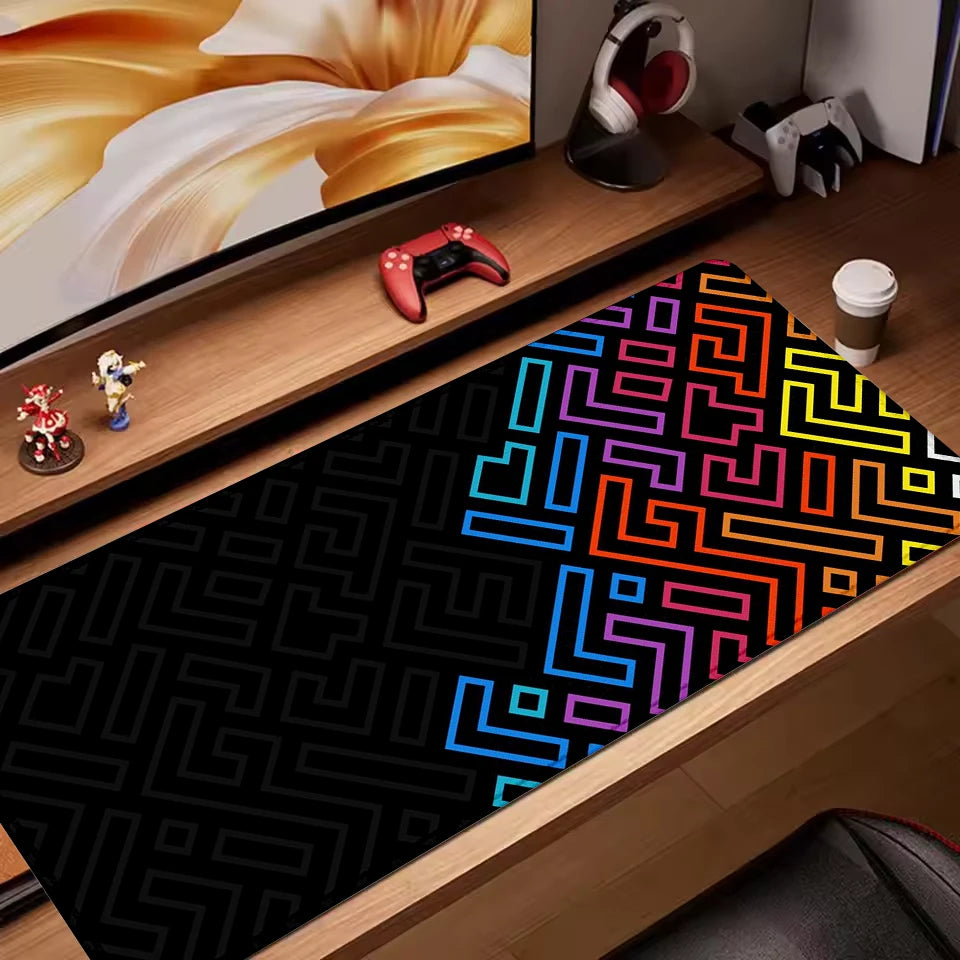 Black desk mat with bright neon maze pattern in blue, pink, orange, and yellow