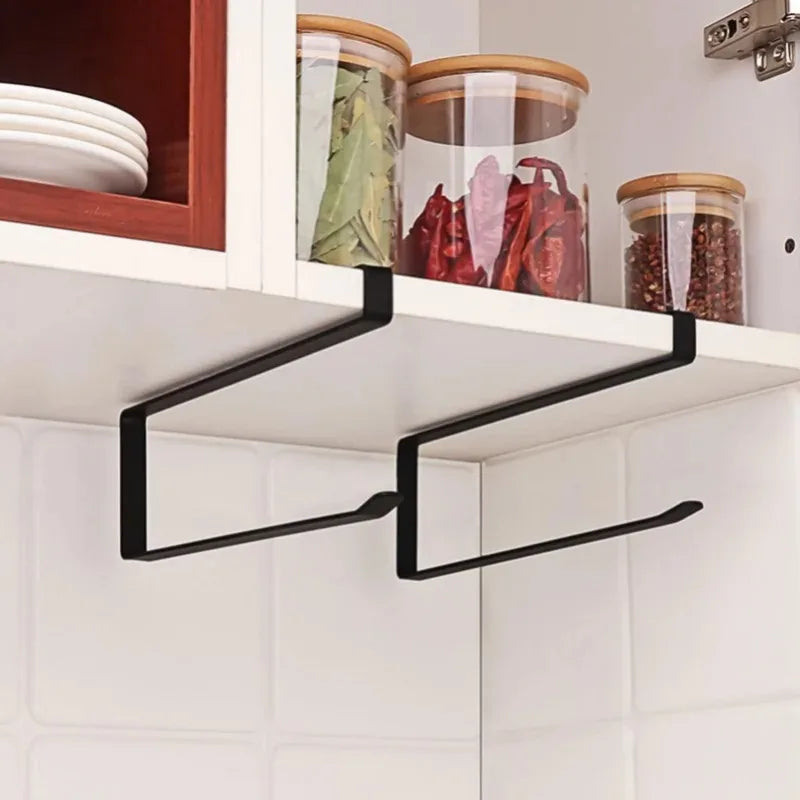 Black metal shelf bracket attached to a kitchen cabinet.