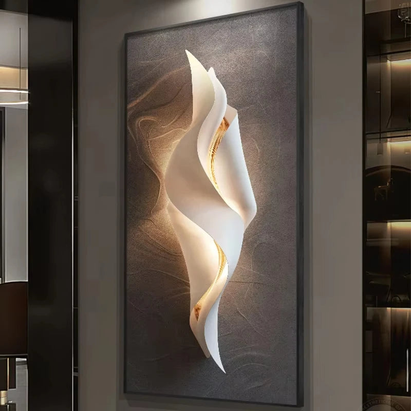 Lumina Flow LED wall art light with compact twisted white ribbon design and warm gold glow on a brown textured canvas