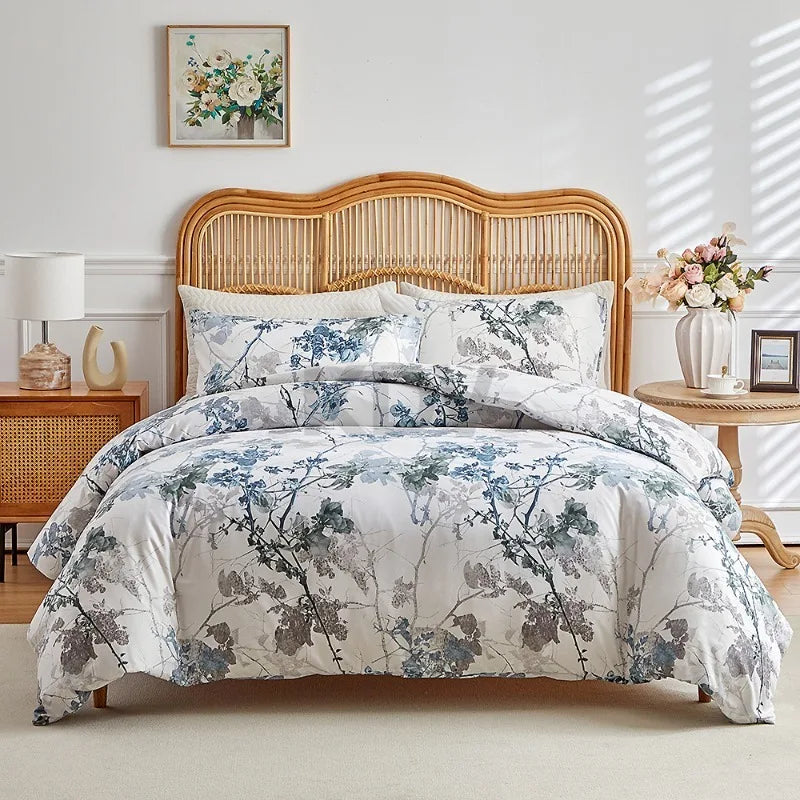 White duvet cover set with blue and taupe branch floral print and matching pillowcases